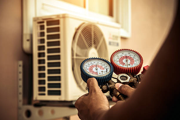 Professional Air Conditioning Service technician working in Lewisburg, OH